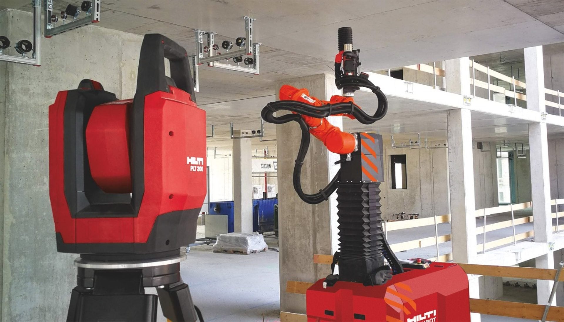 Station totale Hilti PLT 300 et robot de perçage Jaibot sur un chantier de construction pour la pose de supports MEP.